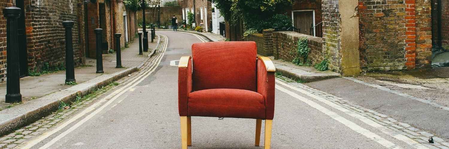 A chair in the middle of the road